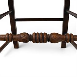 19th century elm chair, with curved top rail and bobbin turned spindles, woven rush seat, on turned legs united by front stretcher