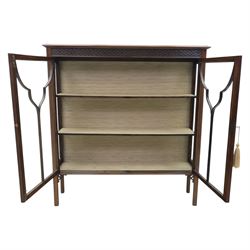 Edwardian mahogany display cabinet, blind-fretwork frieze over astragal glazed doors, square legs with fretwork detail