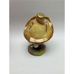 A Royal Crown Derby Mansion House dwarf, dressed in 17th century cavalier costume, with floral waistcoat and hate detailed Auction of Elegant Household Furniture and Effects, H18cm, with printed mark beneath and signed J.Aston, with makers box. 