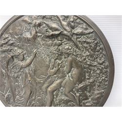 Late 19th century bronze plaque, of circular form, depicting the angel appearing to Adam and Eve in the garden of Eden in high relief, D25.5cm
