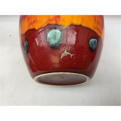 Collection of Poole Pottery, comprising charger and vase in Volcano pattern and a duck figure in a similar pattern 