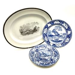 A 19th century Copeland Spode bat-printed oval platter, decorated with central coastal scene, with printed mark beneath, L42.5cm, together with two 19th century blue and white pearlware plates, comprising John Rodgers Fallow Deer pattern, D25cm, and a further example decorated with two figures with fishing nets before a classical temple, D24cm. (3). 