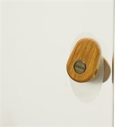 Ercol - elm corner display cabinet, Model 3856. Glazed upper section with glass door enclosing two glass shelves and interior light, above panel cupboard door, with rounded uprights and circular turned handles, on plinth base