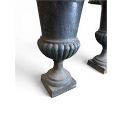 Pair of Victorian design heavy cast iron garden urns, black painted, egg and dart rim on waisted column