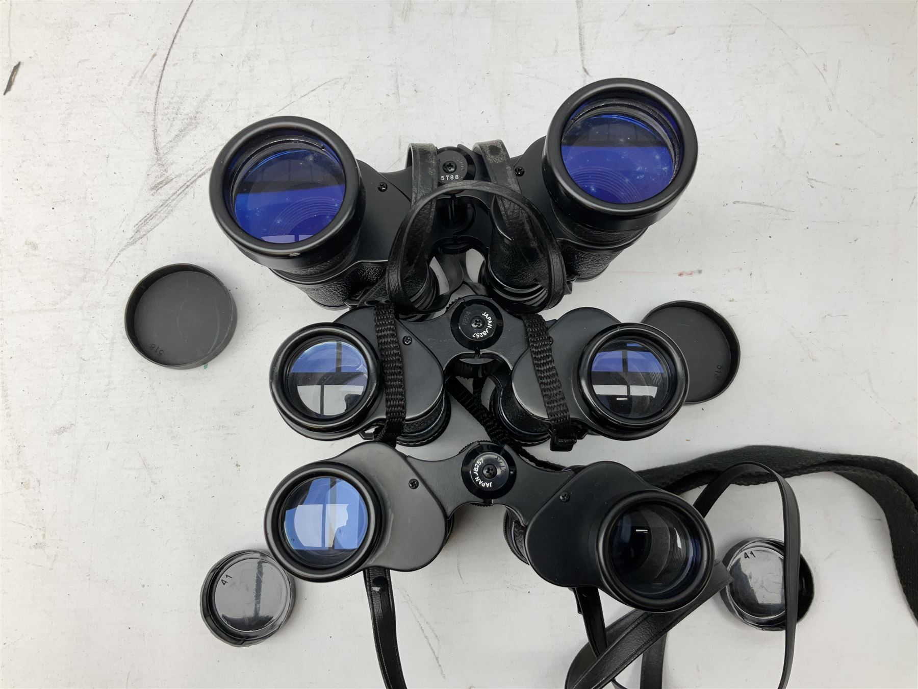 Eleven cased pairs of binoculars, to include Omiya 8x30, Tasco, Esde-Optik 8x40 Weitwinkel, Chinon 10x50 Field. Aico Rapide 8x30, Astralite zoom 6x- 14x32, etc