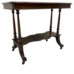 Late Victorian mahogany Aesthetic movement side table, moulded rectangular top with rounded corners, turned pillar supports on undertier, on splayed feet with brass and ceramic castors