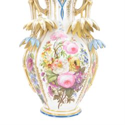 Large mid 19th century French porcelain vase, of baluster form with raised twin handles with applied stylised flower heads, the body painted with panels of pronounced floral sprays within blue and gilt borders, H58cm