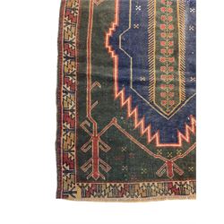 Persian Baluchi, overall geometric design, the field with lozenge and trailing foliage, repeating border decorated with geometric motifs