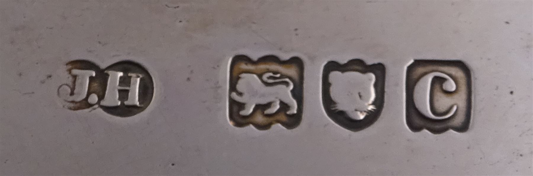 Victorian silver waiter, of typical form, with shaped rim embossed with C scrolls, upon three scroll feet, hallmarked Sibray, Hall & Co, London 1898, D18.5cm