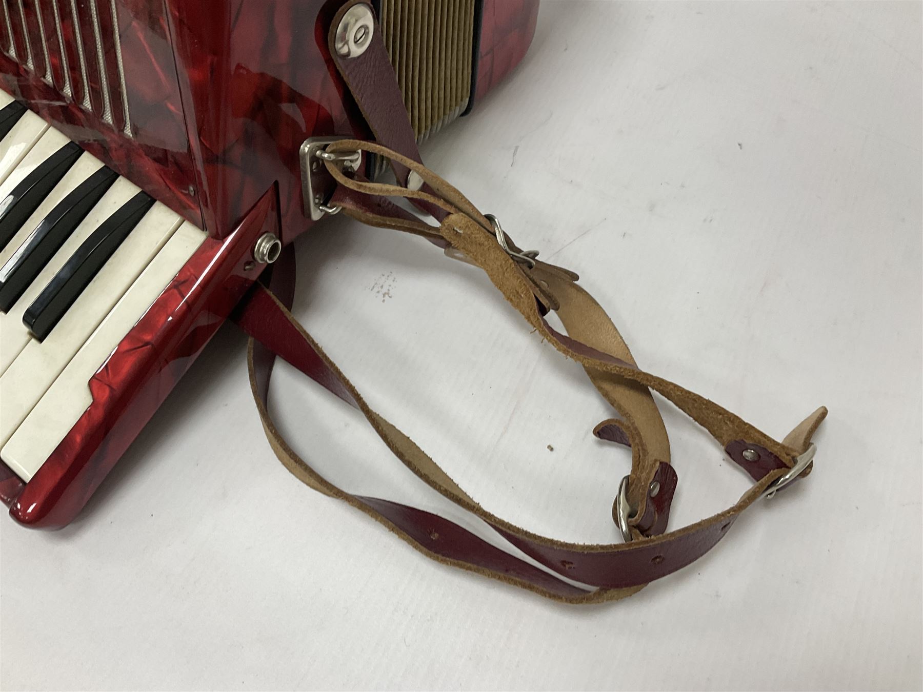 German Hohner student II compact accordion with 26 keys and 12 bass registers in a hard case With tutor