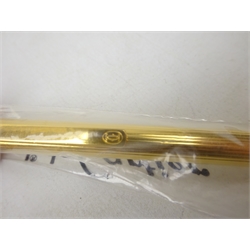  Cartier: Stylo Bille Must II ballpoint pen with reeded gold plated body, serial number 138071, in original sealed wrapping, with certificate, guarantee and instructions in original box with outer box  