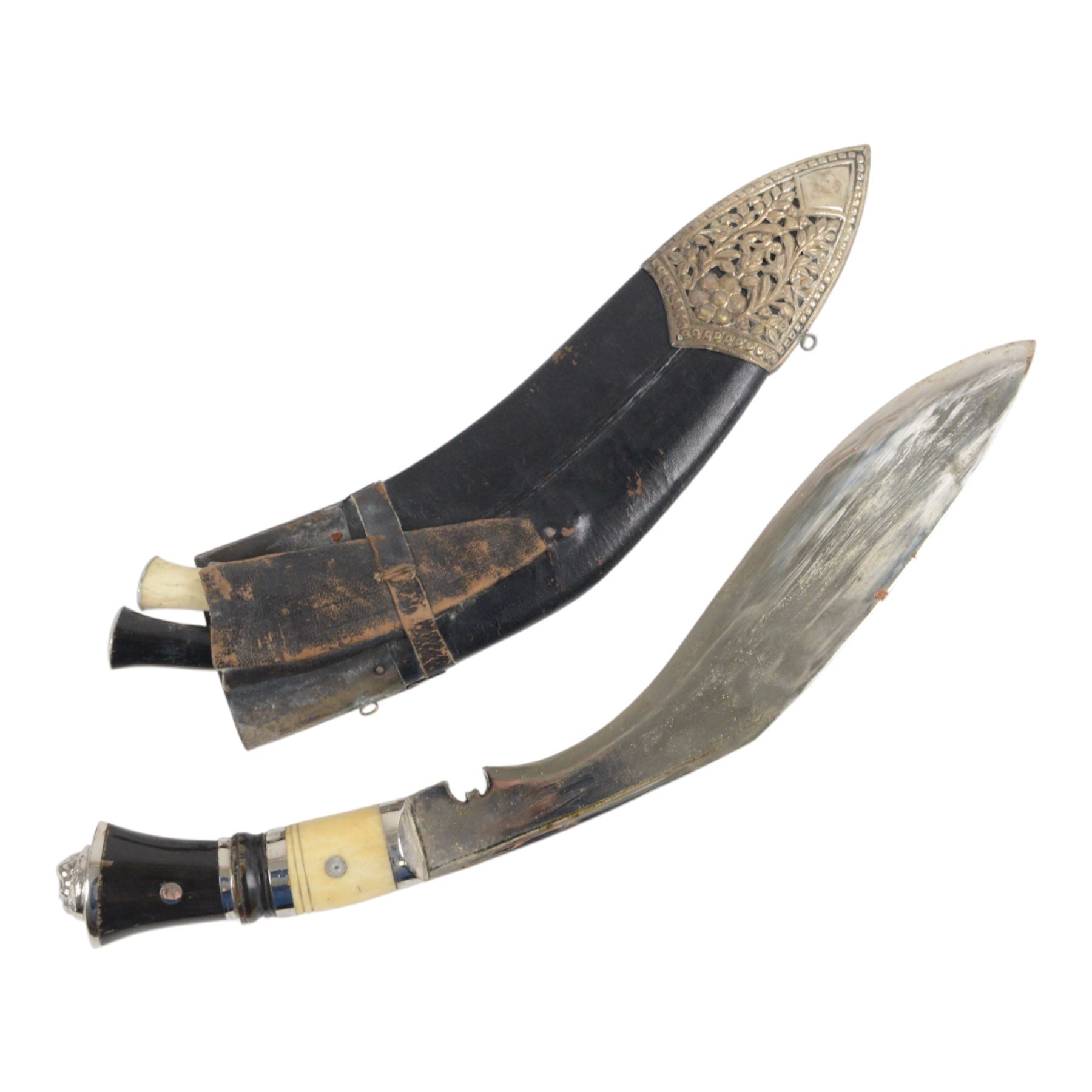 Pair of kukri knives, with with ebonised and bone handles, with two smaller knives, with a leather scabbard with floral silvered decoration, L44cm