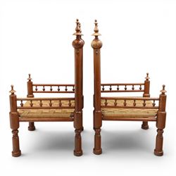 Pair of Anglo-Indian brass inlaid hardwood low chairs, the backs with turned spindle rails and rectangular panels inlaid with scrolling foliate decoration, woven rush seats within moulded frames, raised on turned supports with ring turned feet