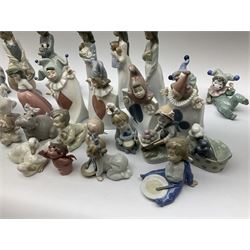 Collection of Nao figures, including four playing card jesters, two clowns, Virgin Mary and baby Jesus , five geese etc. 