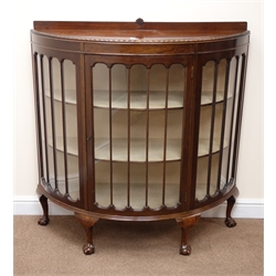  Early 20th century mahogany demi-lune display cabinet, raised back with shell carving, glazed door enclosing lined interior and two shelves, cabriole legs on ball and claw feet, W116cm, H120cm, D42cm  