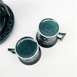 A Portmeirion coffee set, designed by Susan Williams Ellis, comprising coffee pot, six coffee cans and six saucers, six side plates, and an open sucrier, each with a teal ground decorated with roundels. 