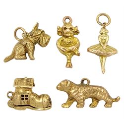 Five 9ct gold charms including Lincoln Imp, fairy, tiger, shoe house and Scottie dog