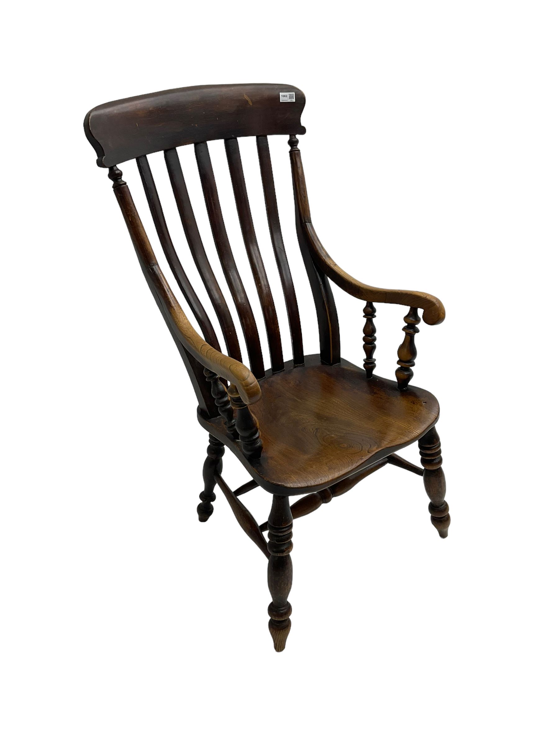 Late 19th century elm farmhouse armchair, high lath back raised on turned supports united by stretcher