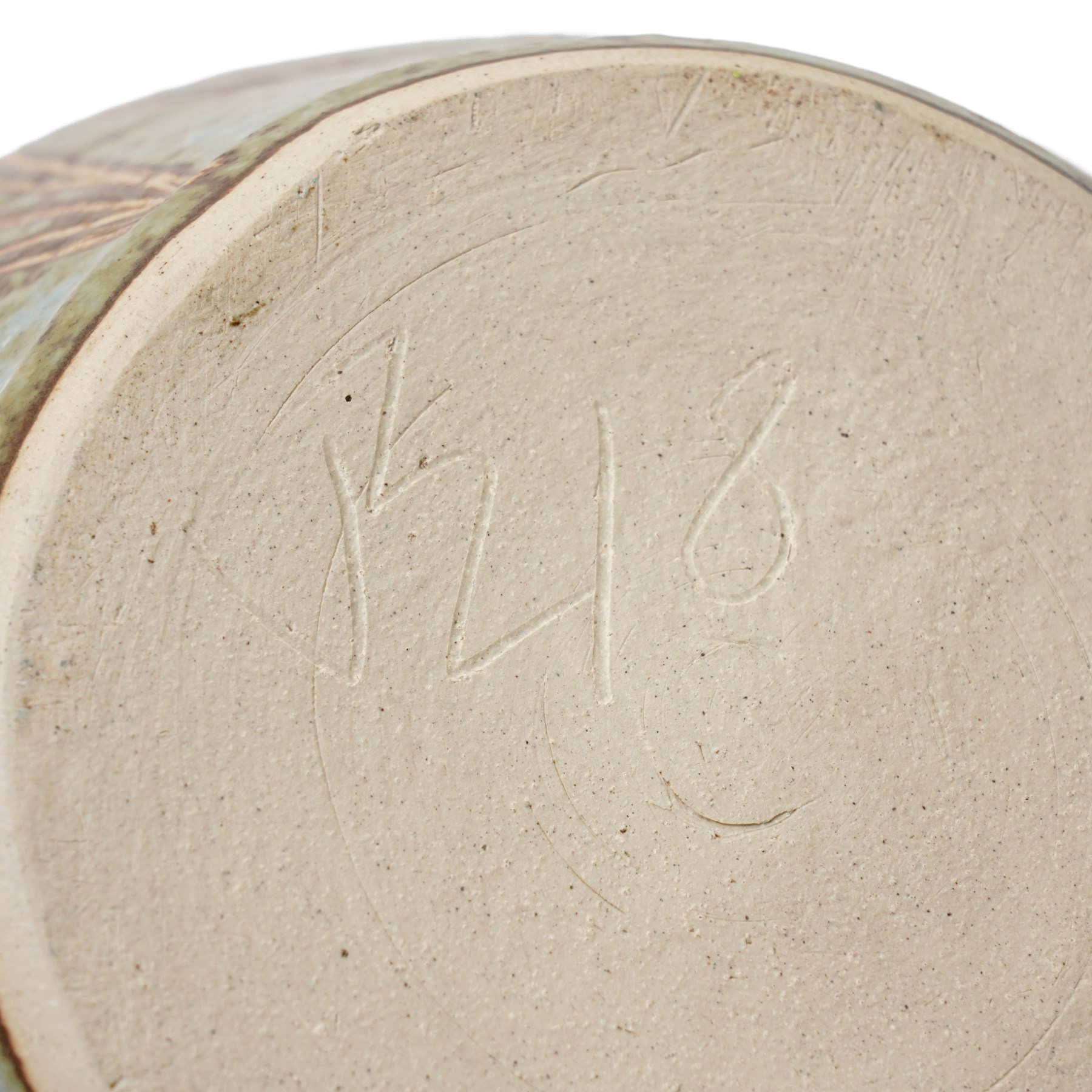 John Egerton (c1945-2024): Stoneware planter, decorated with carved flower motif, mottled blue background and scalloped rim, marked beneath, H18cm
