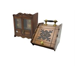 Edwardian oak smokers cabinet, broken swans neck pediment, two bevelled glazed and panelled doors enclosing four small drawers and pigeon hole (W42cm H45cm); Edwardian oak coal scuttle, carved fall-front with brass handles (W32cm H37cm)