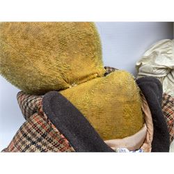 Two early 20th century straw filled jointed teddy bears, first example wearing a tweed jacket bearing Geoffrey Saville label, with leather padded paws and ears, horizontally stitched nose and humpback; second example with applied eyes, vertically stitched nose and faux leather paw pads, both with growler mechanisms, tallest H74cm 