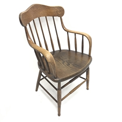 American oak spindle back desk chair. shaped cresting rail, solid seat, turned supports joined by stretchers, W60cm