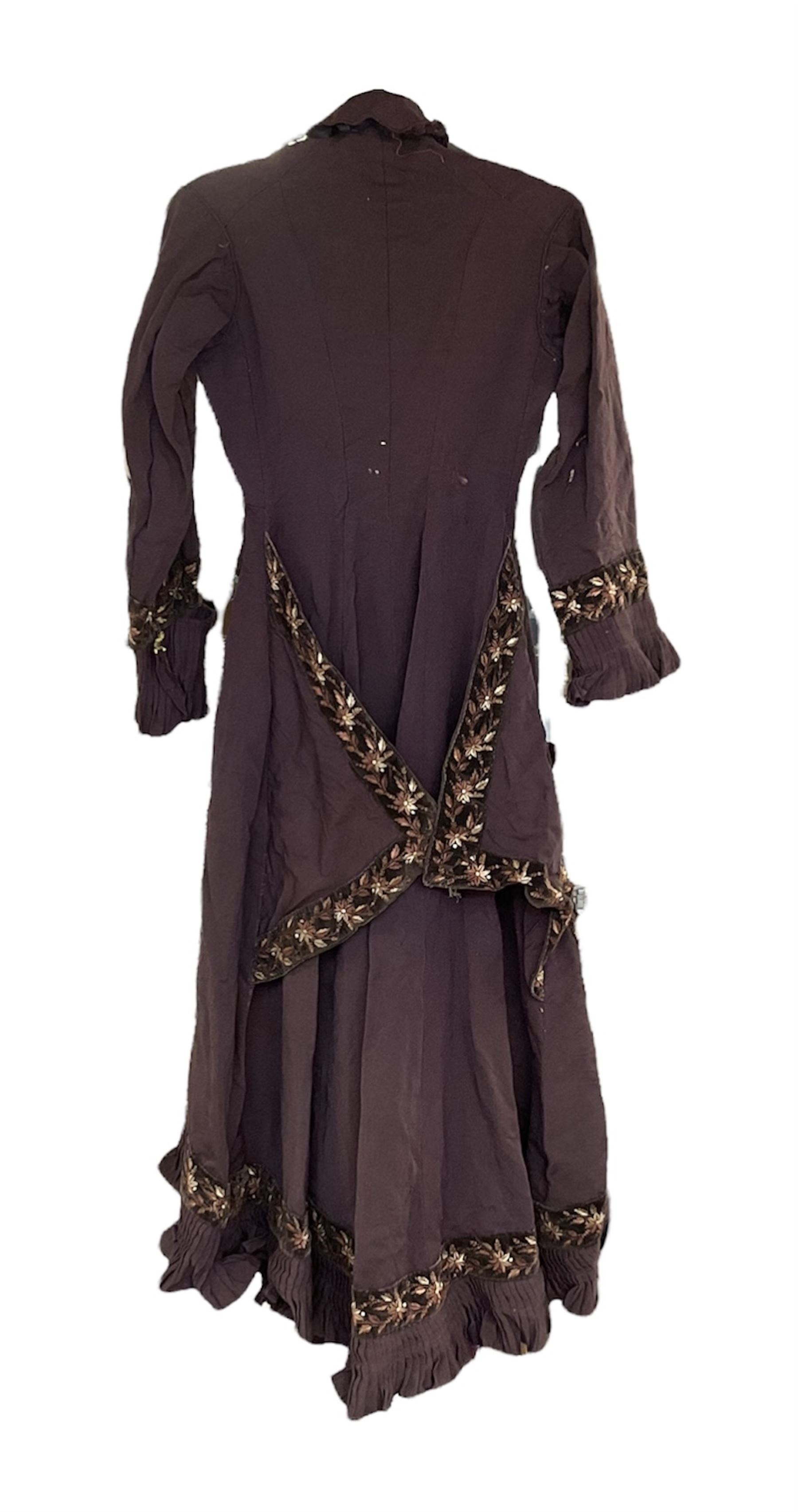 Victorian ladies riding habit, the two-piece construction in brown with embroidered floral velvet edging