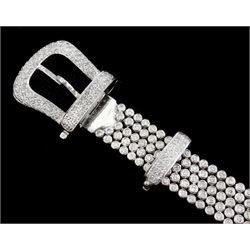 14ct white round brilliant cut diamond belt bracelet, the bracelet with rubover set diamonds, the buckle and clasp with pave set diamonds, stamped 14K, total diamond weight 5.35 carat