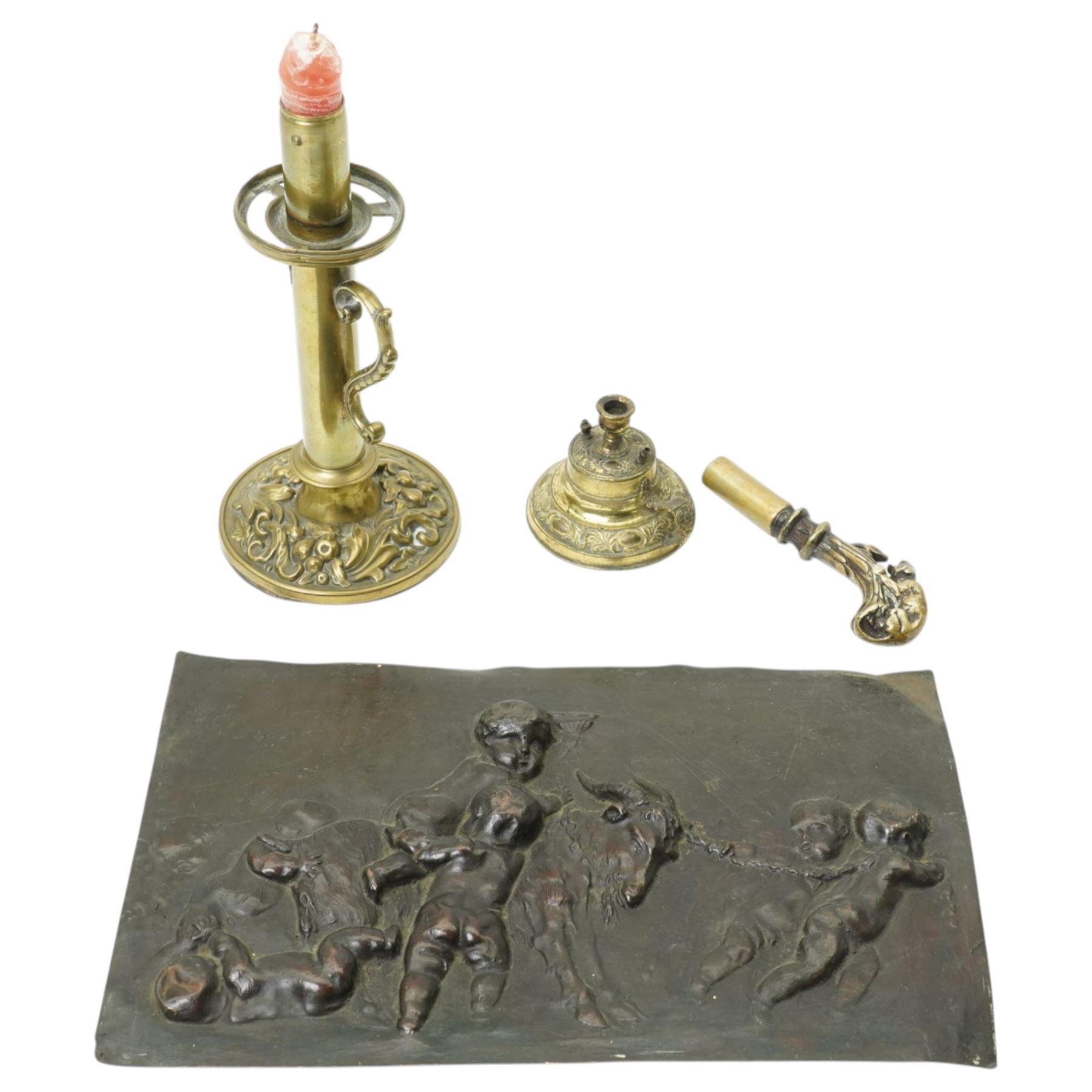 Cane handle in the form of a mongoose and snake, brass oil chamber stick, another and a copper panel decorated in relief with cherubs and a goat 20cm x 32cm