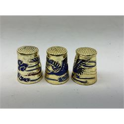 Twenty cloisonné thimbles, decorated with, flowers, birds, dragons, snakes, and other animals