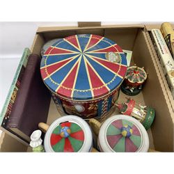 Collection of circus and fairground collectables, to include teapots, biscuit tins, including musical examples, and four Circus/fair themed books, including two library first editions