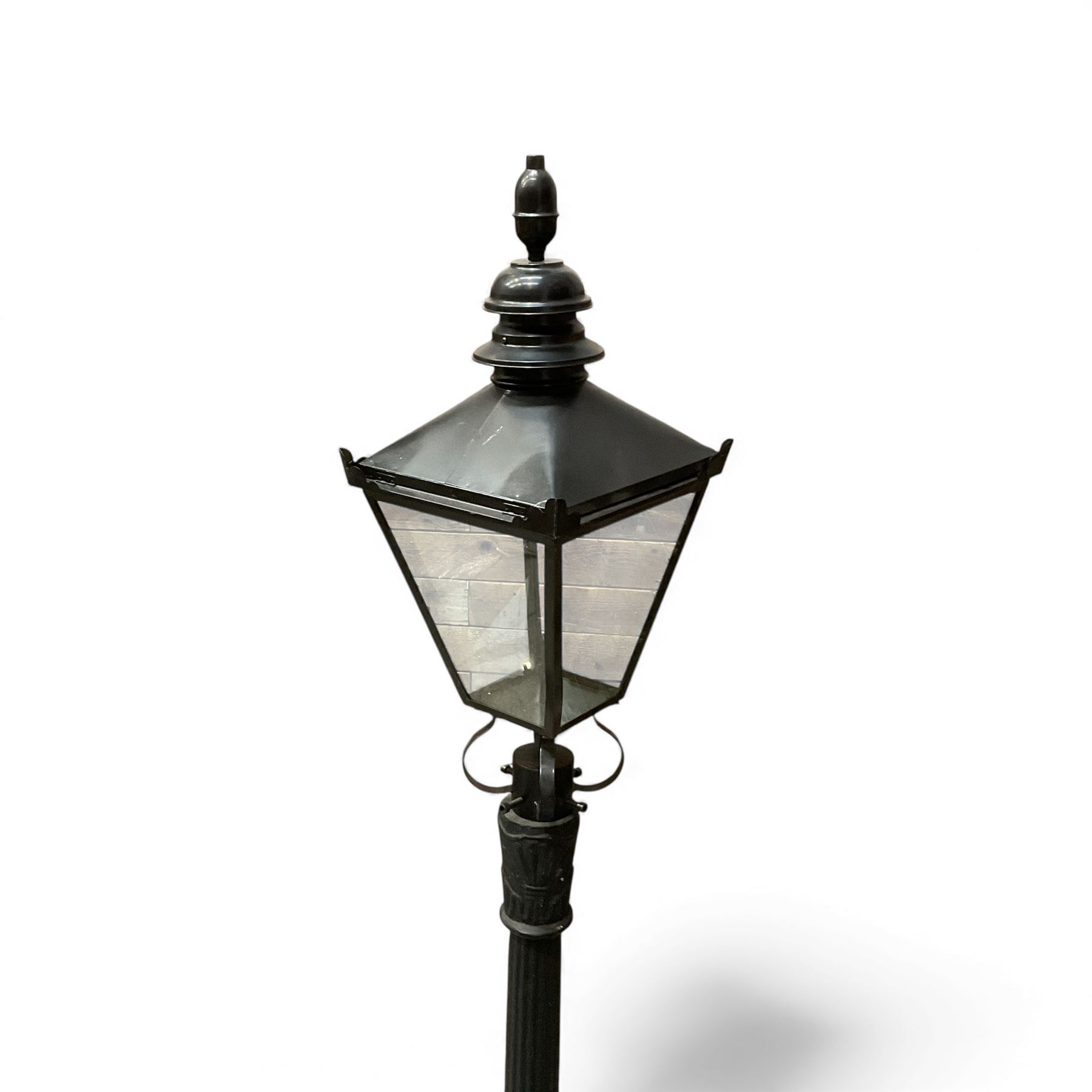Victorian-style cast iron lamp post in a black finish,