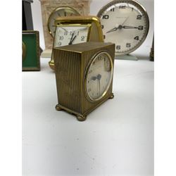 Miniature 'Zenith' travel alarm clock, in engine turned brass case with silvered numerical chapter ring, H5cm, together with other clocks to include Aynsley Portland Ware mantel clock, with moulded peacock design, Europa travelling clock, brass carriage clock, German copper clock of cube form etc