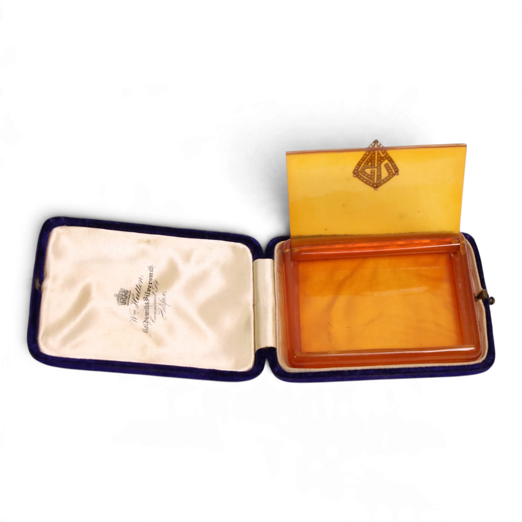 Art Deco Bakelite cigarette case, of rectangular form, the hinged lid with applied platinum monogram, millegrain set with rose cut diamonds