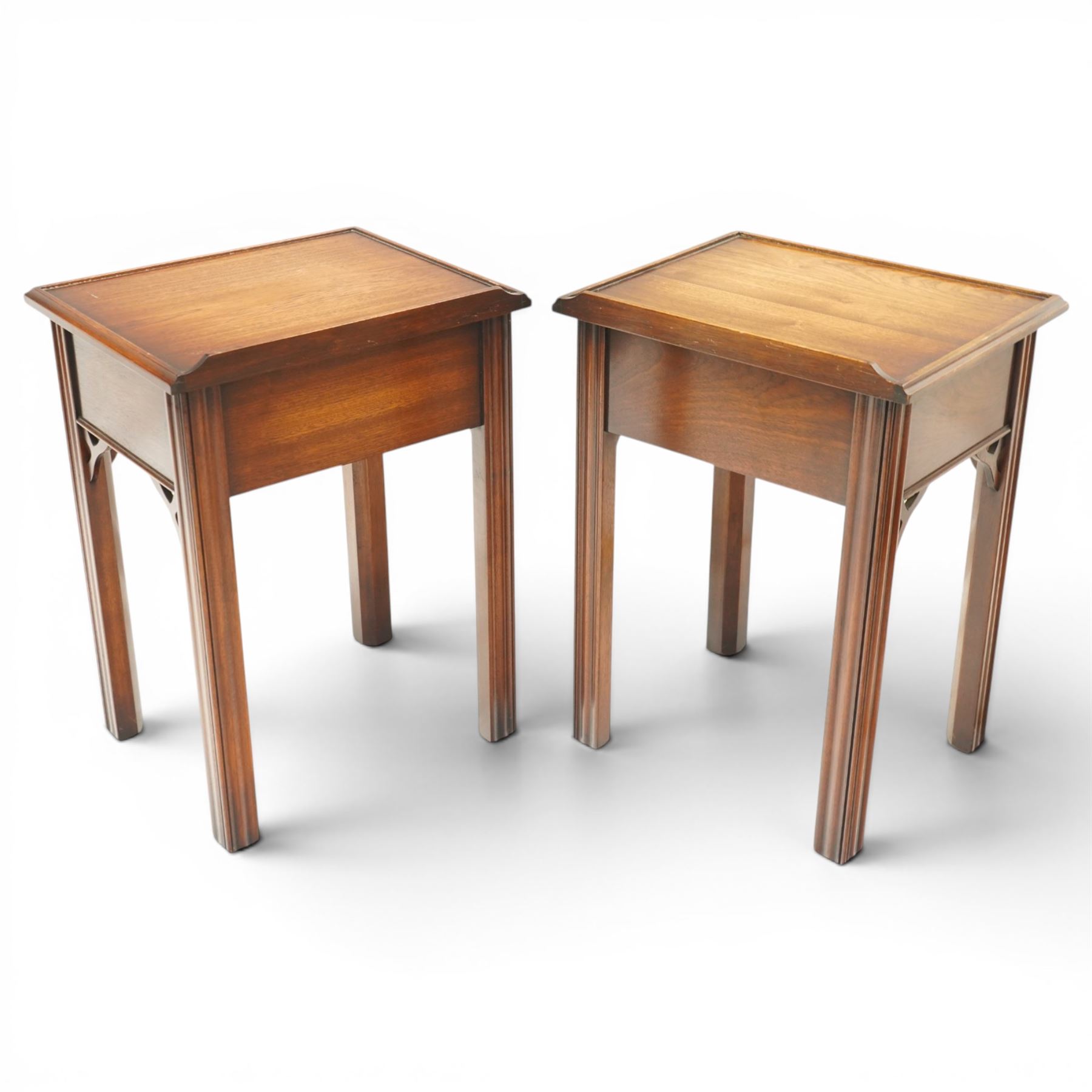 Pair of mahogany bedside tables, with quarter galleried top, single drawer with brass swan neck handle, pierced spandrels on fluted square supports  