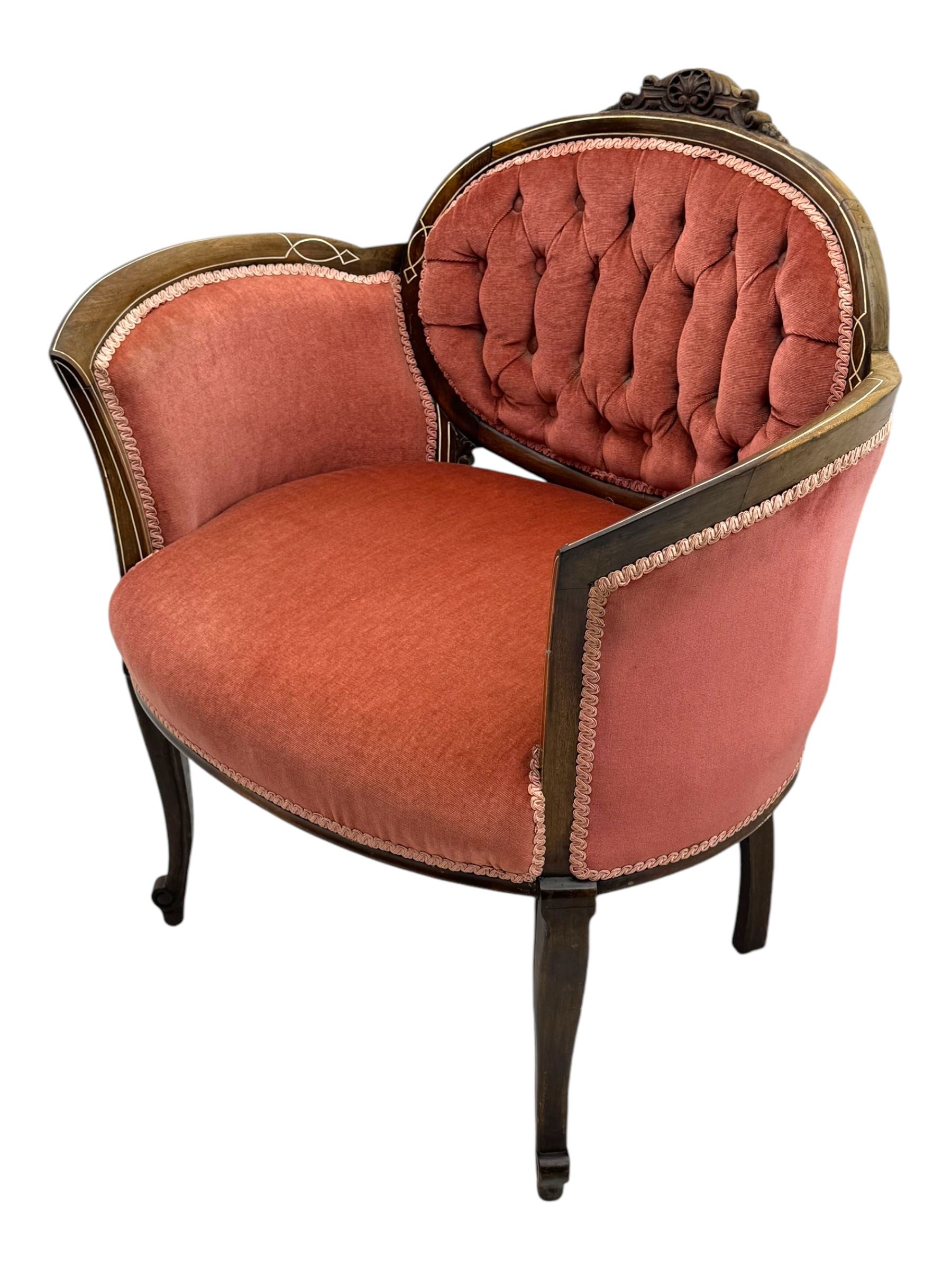 Edwardian inlaid rosewood parlour suite, comprising pair of tub shaped armchairs (W77cm, D69cm, H88cm); and matching two-seat sofa (W112cm, D69cm, H88cm), each with carved crest rails with shell motifs, deep button-tufted oval backs upholstered in pink fabric with braid trim, on cabriole supports