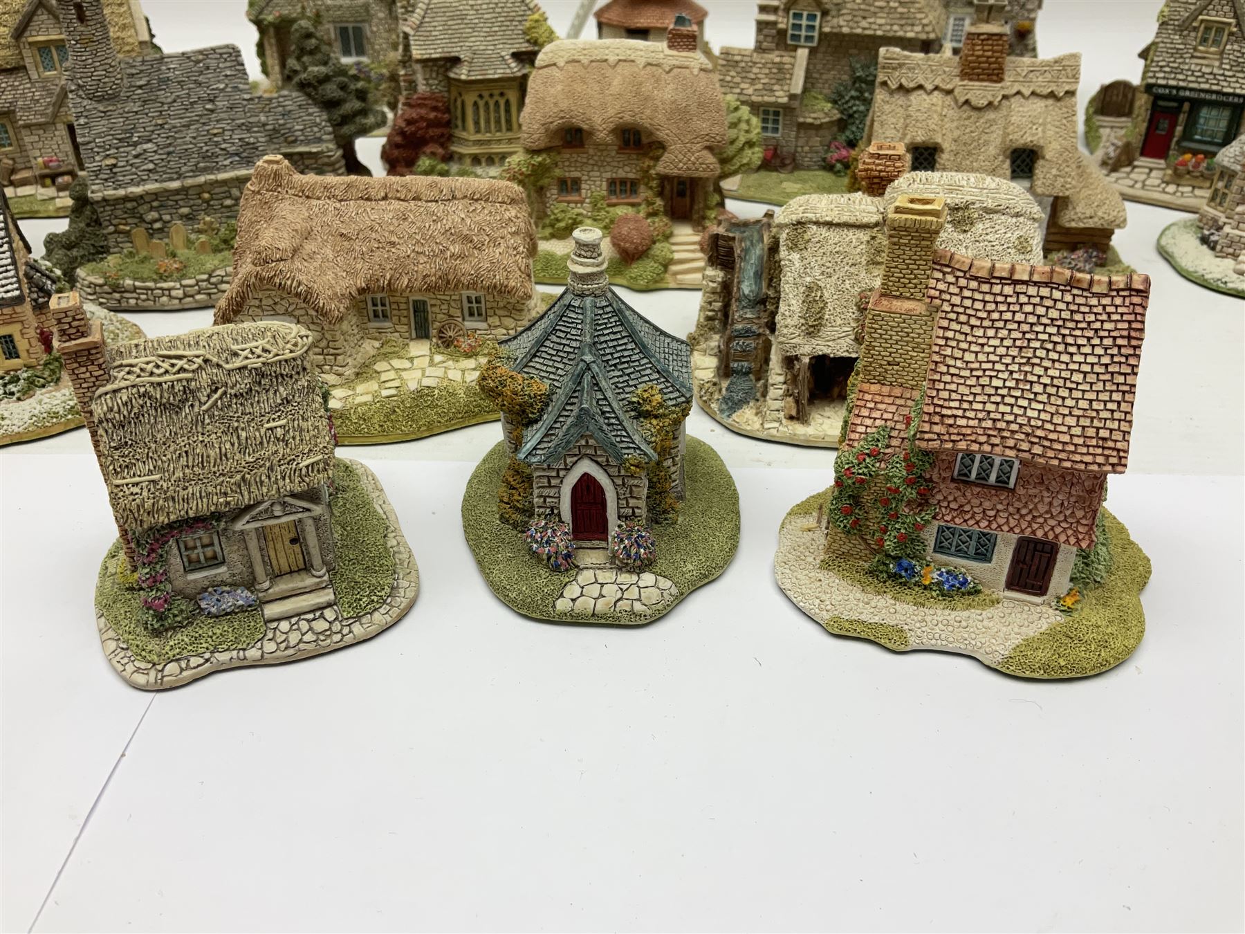 Twenty Lilliput Lanes, including The Chocolate House, Chiltern Mill, Blaise Hamlet, St Kevin Church, some with deeds and original boxes