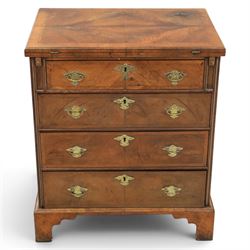 Early 20th century Georgian design figured walnut bachelor's chest, with half fold over top and lopers, over three drawers with pierced brass handles and escutcheons 