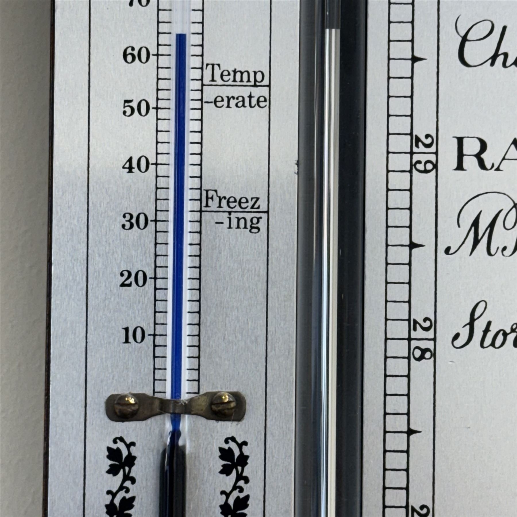 Rapport London -  20th century mercury stick barometer, in a mahogany case with a silver register and an adjustable circular brass recording collar, register indicating barometric air pressure from 27 to 31 inches, with a Fahrenheit spirit thermometer, full length visible cistern tube with a turned wooded cover to the base. 