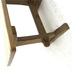 'Acornman' oak coffee table, rectangular adzed top on shaped end supports connected by pegged stretcher, by Alan Grainger of Brandsby, 61cm x 36cm, H39cm