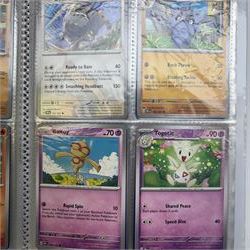 Collection of modern Pokemon TCG trading cards from the Scarlet & Violet and Sword & Shield eras, contained within in two folders, opened packets and loose, together with a graded Sword & Shield Silver Tempest Passiman TG08, GET Graded 9 Mint, two oversized cards, energy cards, vintage booklets and boxes, empty tins, 1998 Electronic Pokédex and other accessories