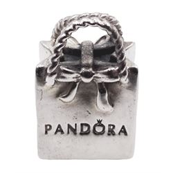 Five silver Pandora charms including Pandora shopping bag, Christmas tree, wrapped present, Winter scene, and snowman with reindeer droplet charm, all stamped S925 ALE, with one Pandora box 