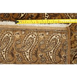 North West Persian Tabriz hand-knotted carpet, field with an all-over repeating boteh design arranged in rows, enclosed by a complimentary border flanked by guard stripes, in a palette of camel, beige and brown tones, with cotton fringe ends 