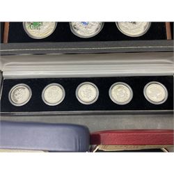The Royal Mint United Kingdom 1977 silver proof two coin set, Queen Elizabeth II 2002 silver proof three coin set, comprising Bailiwick of Jersey, Bailiwick of Guernsey, and Alderney five pound coins, 'First Coinage of the British Virgin Islands' proof set, 1997 1/10 ounce fine silver Britannia, two King George V 1935 'Rocking Horse' crowns, various Isle of Man commemorative crowns, etc., house in a hard shell carry case