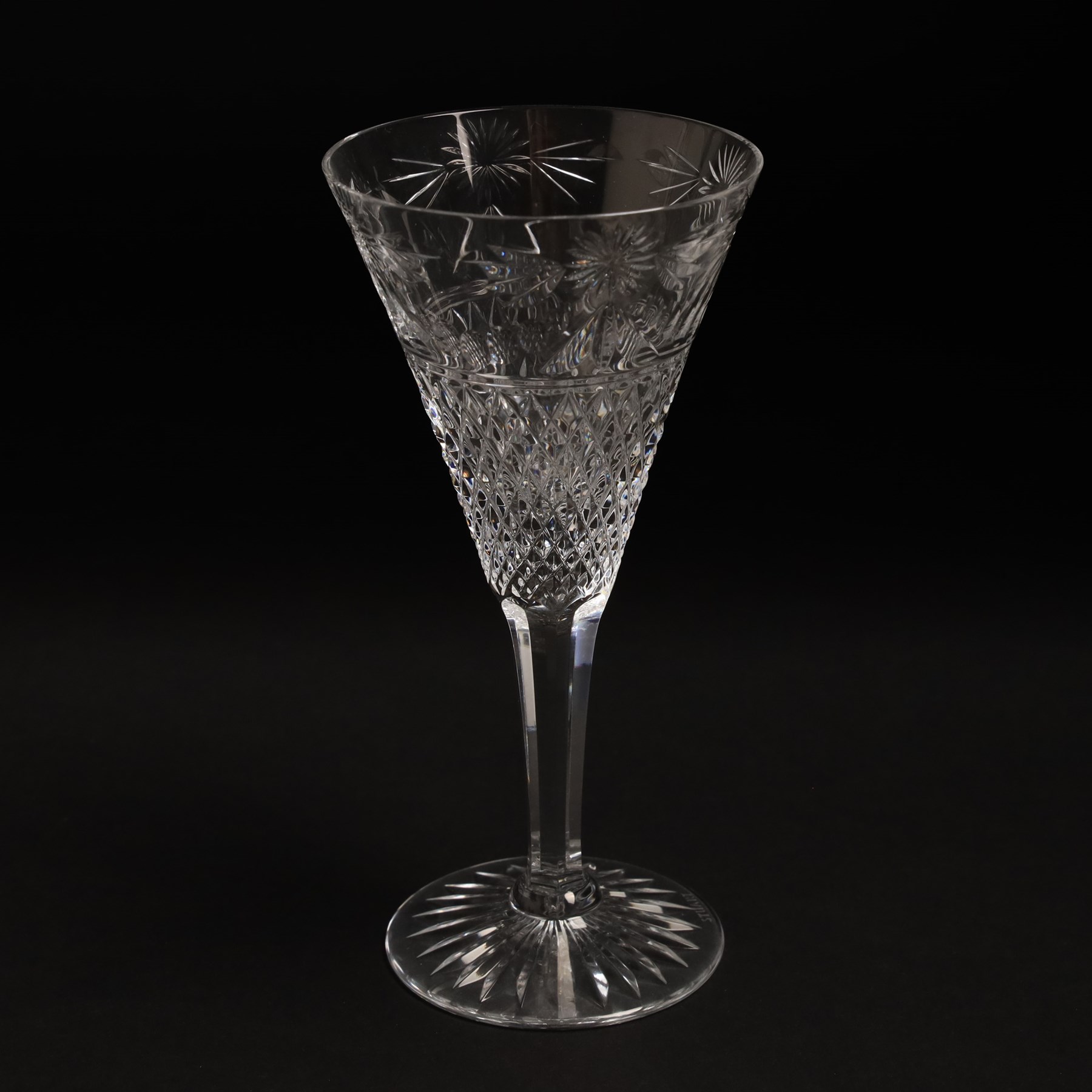  Suite of Stuart crystal Beaconsfield pattern table glass, comprising 6 claret glasses, 6 white wine glasses, 6 dessert wine glasses, 6 brandy balloons, 6 champagne flutes, and 9 whisky glasses