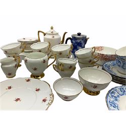 Collection of tea wares including set of four cups and saucers and six side plates decorated with blue transfer printed foliate decoration with gilt edging, set of six cups and saucers and side plates decorated with red transfer printed foliate and a set of Lubern 22kt gold tea wares. 