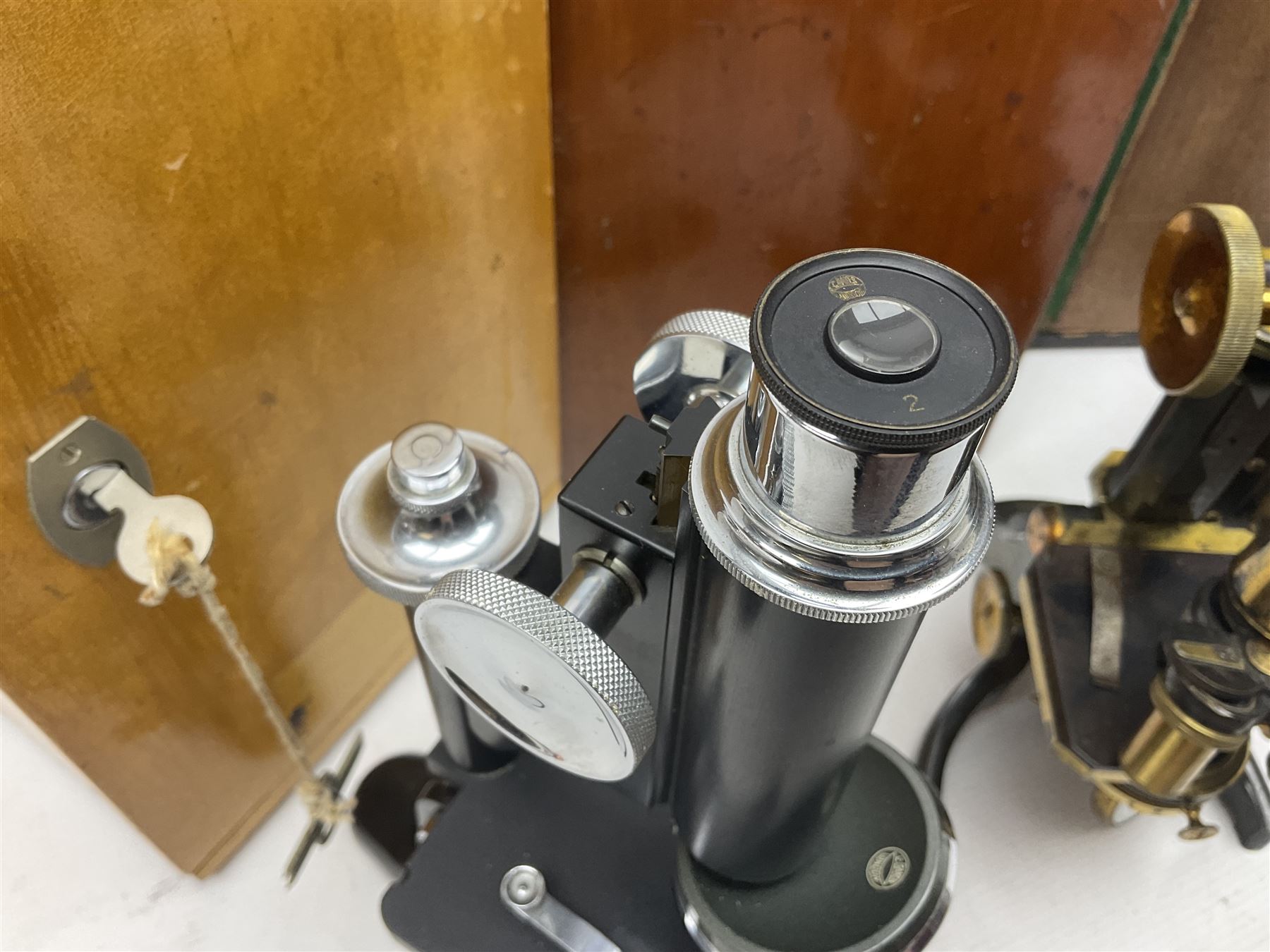 Three microscopes, comprising Swift and Son, Beck model 22 no 5512 amd E. Leitz Wetzlar no 113555, all boxed