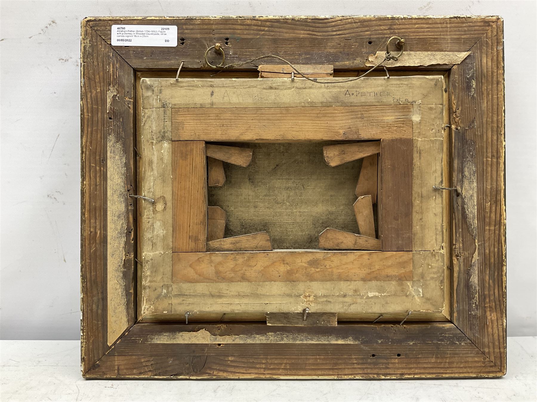 Abraham Pether (British 1756-1812): Figure with a Donkey in Wooded Countryside, oil on canvas signed 18cm x 23cm