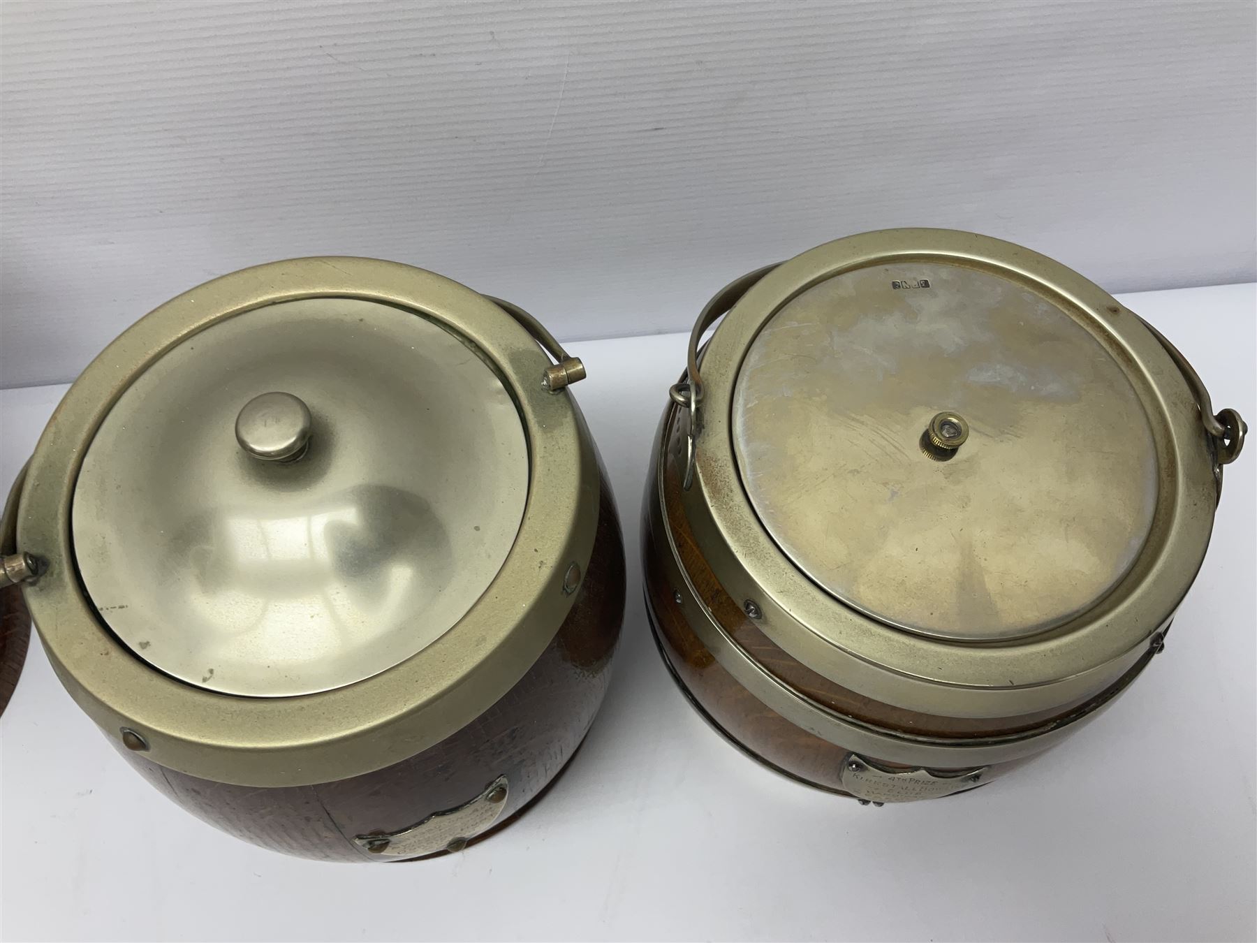 Five early 20th century biscuit barrels with silver-plated mounts, one made from Mahogany from HMS Hindustan