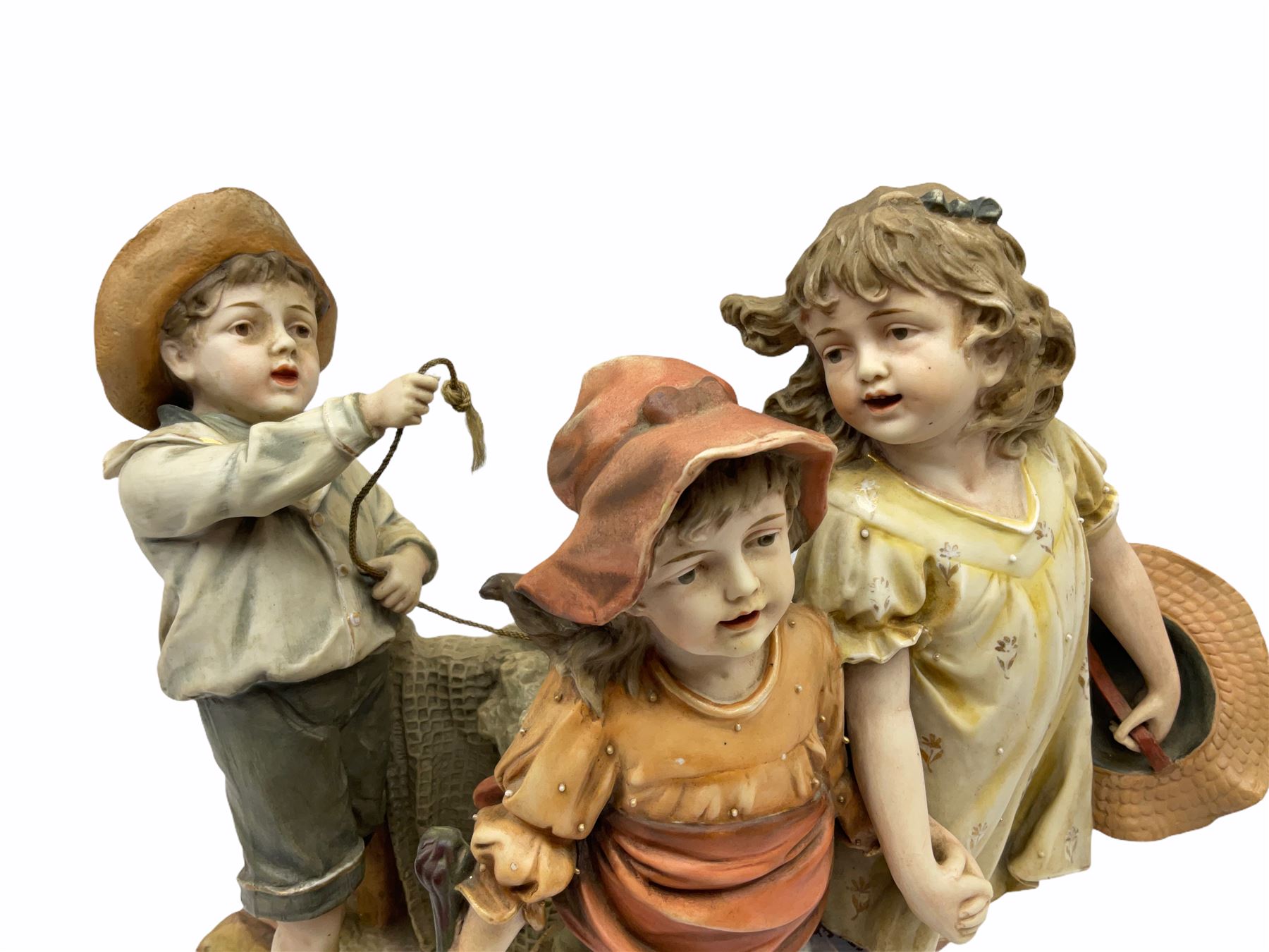 Large Victorian bisque figure group, modelled as three children at a beach with fishing net and seaweed, inspired by the Victorian painting 'The Sea Horses', H33cm L36cm 